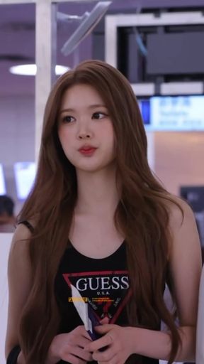Korean k-pop fan with big boobs shows off her tank top and lips