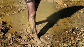 Muddy feet, black stockings in mud, white nylon socks in mud, knee high socks in mud, muddy girl, feet stuck in mud