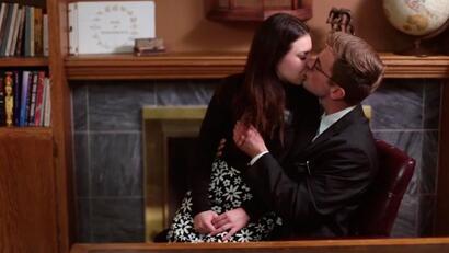 Kissing passionately in the office of the Mayor