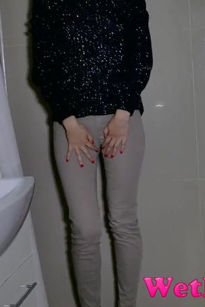 Jeans button stuck, she has to pee in her pants Wetting her jeans and pouring pee from her shoes.