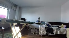 Amateur mom does chores in the naked house.
