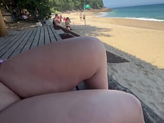 Brunette naked on the beach showing her ass on the road to truck drivers