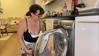 Milf with big boobs is cleaning the house