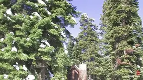 Captive girl with exposed boobs pleases her mountain captor