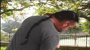 People watch while he fingers his wife in the park