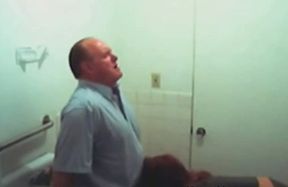 Chubby mature guy getting blowjob in the public restroom