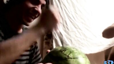 Twho three kinky guys are fucking watermelons on the camera