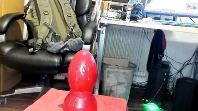 Perverted dude in leather stockings takes huge toys in the ass