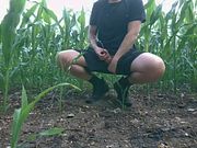 Guy Pissing a Lot Near the Field in Nature