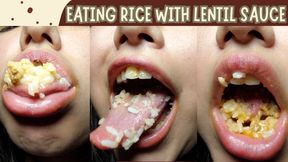 Eating rice with lentil sauce