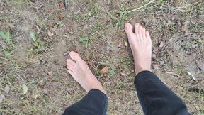 Walking barefoot in the garden and showing my dirty soles