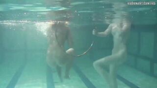 Russian dyke girls swimming into the pool