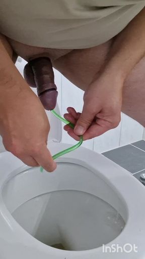 Cock stretching with 14mm ball sound and piss drained through silicone hose in peehole