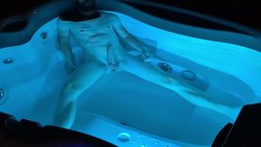 A boy takes a bath at night in a lit bathtub and gets excited