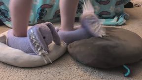 Luna trampling on, crushing, and dancing on 2 plushies with her big purple bunny slippers. plushie stomp 1