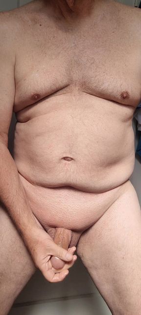 Morning masturbation - shaved, oiled, and ready to start my day with a slow stroke of my cock