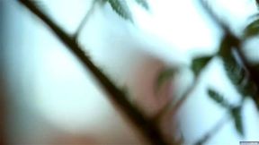 Kenna James waters the plants