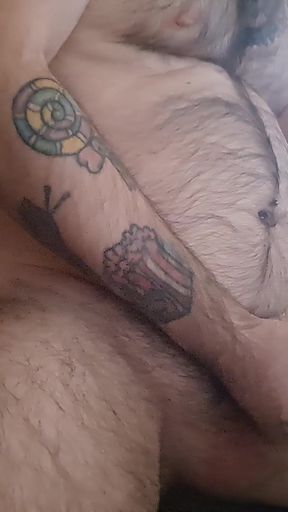 The Bear Masturbates in Bed with His Hairy Body