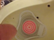 Pissing at the park urinal