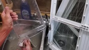 Cute boy tantalizes while cleaning the fridge