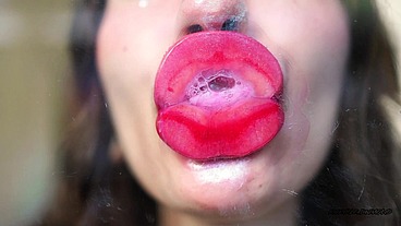 Wet red sticky lipgloss kiss