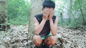 A mischievous Asian boy masturbates, moaning and ejaculating in the atrium garden of an abandoned hotel