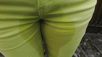 Anya wetting green jeans outdoor