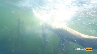 Nude cougar Swimming into the River with her Dogs (underwater