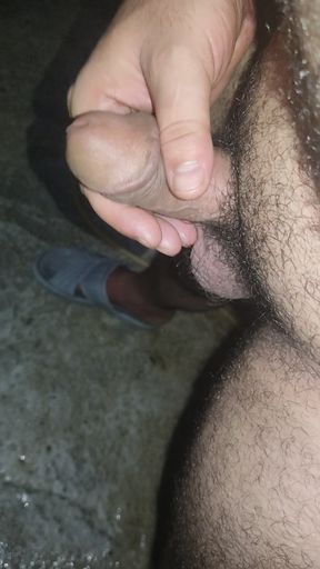 Young man massaging penis