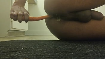 Teen fucks his ass with carrot and orgasms