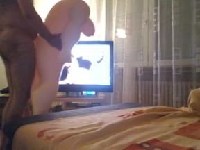 Big Love Doll in front of TV - watching a granny porn