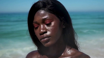 Beautiful and fit ebony babe Naomi Nash gets fully naked on the beach