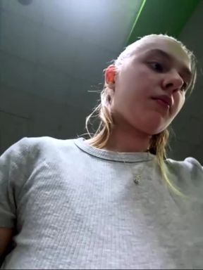 Public masturbation: A horny beauty at the FIT gym massages her pussy and cums on a bench in the locker room.