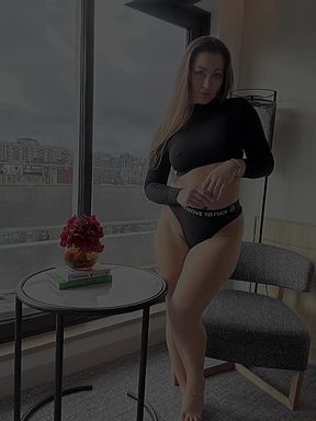Blonde solo model poses professionally while sitting