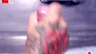 Muscular inked Vikko Vigo stroked his gigantic cock while gripping his hefty trimmed