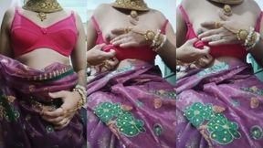 Indian Gay Crossdresser Bottom Gaurisissy pressing and playing with her big boobs in purple saree with heavy jwellery