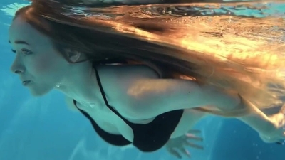 Perfect body blonde teen enjoys naked swimming