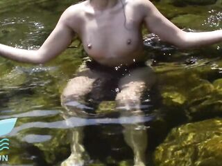 marvelous blonde is seen swimming alone bare and warms up facial in the face