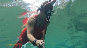 Carissa snorkeling in her Christmas outfit with exposure part two