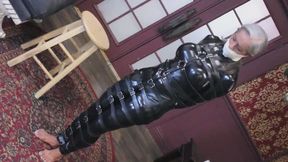 Catsuit-clad captive Luna, wrapped in countless leather restraints