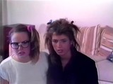 Two adorable curly haired chicks take a bath together and scissor their wet pussies until they cum