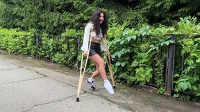 Lia is walking on wooden crutches, crutches walking, leg cast, broken foot