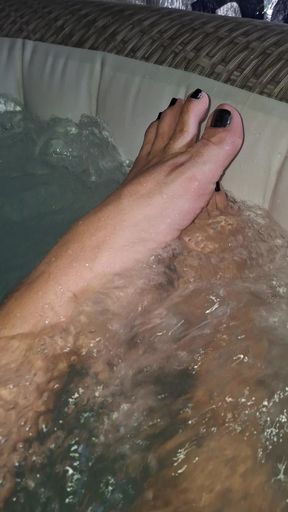Showing my painted toes in the hot tub