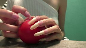 Clawing and crush tomato with nails