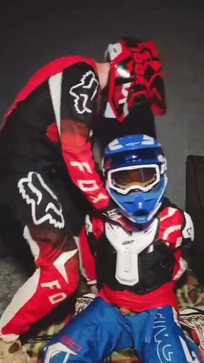 A Guy in a Motocross Gear Gets a Portion on His Mxhelmet