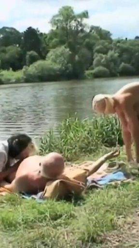 A blond girl washes herself by the river and two old men see her and want to fuck her