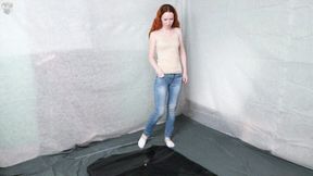 Jeans in a black vacuum bed