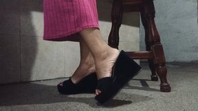 Vannesa taps her fingertips against the platform heels as they dangle (7)