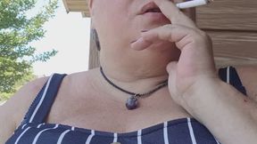 Casual outdoors smoking on a hot summer morning