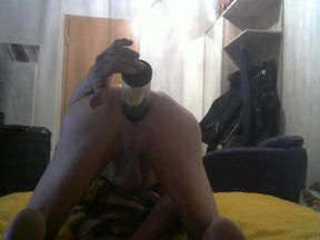 ..ass up, face down and inserting a huge cylinder filled with balls